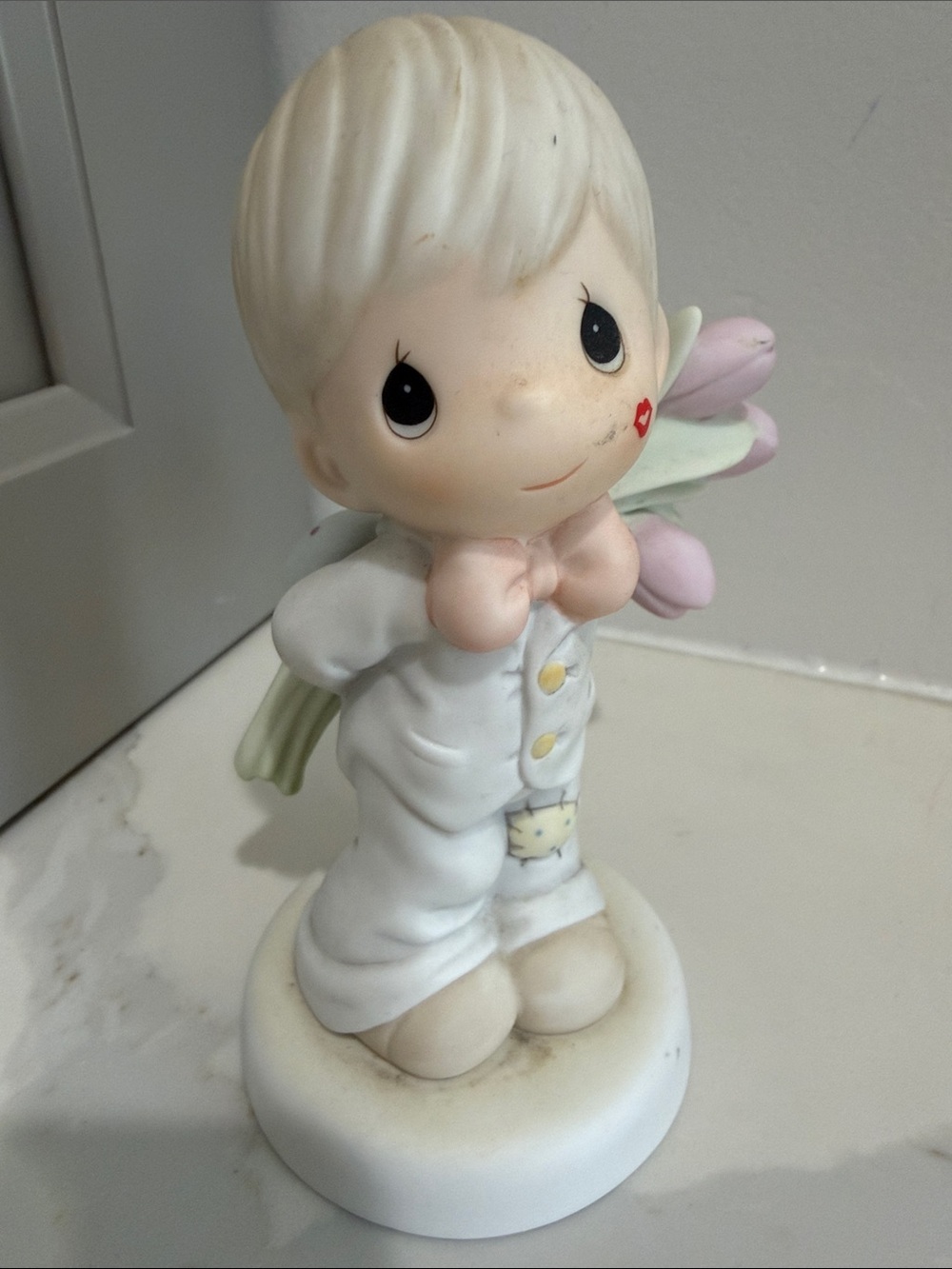 Precious Moments Figurine with Pink Bow and Pastel Flowers